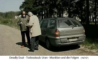 bombed,
                                Serbian army camp 01, Dr. Gnther and
                                Mitar Visnic put on gloves and
                                protective mask