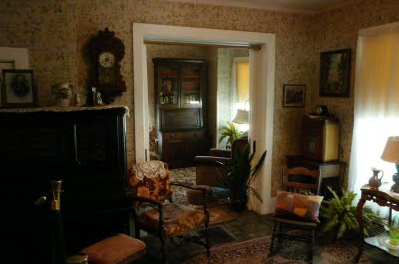 Eisenhower home with brown wallpaper and
                        furniture