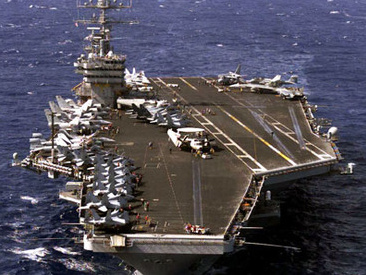 Aircraft carrier with the
                  name of mass murderer Eisenhower