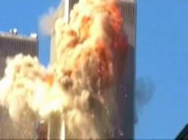 TV film: Airplane impact into the WTC North
                        Tower, TV film. The explosion cloud indicates
                        that a big part of the kerosene burns out of the
                        tower, but there is happening something more...