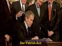 Little Bush signing the "Patriot
                        Act", a muzzle for the people and the
                        media.