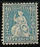 Schweizer Briefmarke mit
                        sitzender Helvetia