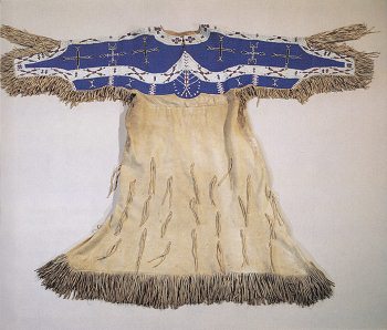 Woman dress with beading work in blue and
                          white, Rosebud Sioux primary nation