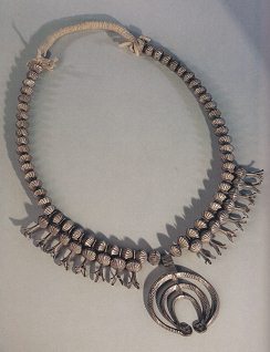 Navajo necklace with pumpkin flowers
                            and half moon