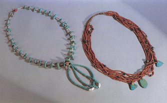 Navajo necklace with turquoise
                            gemstones and of Pueblo Santo Domingo
                            natives with coral pearls