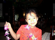 Thailand, a girl selling flowers in Chiang Mai in
              a bar