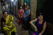 Bangladesh, a mama-san with
                                "her" partly enslaved girls is
                                waiting for customers in the brothel of
                                "Joinal Bari" in Faridpur in
                                Bangladesh