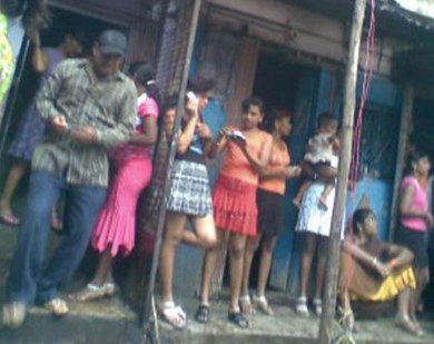 Calcutta, Sonagachi District,
              prostitutes in a file, probably enslaved young women