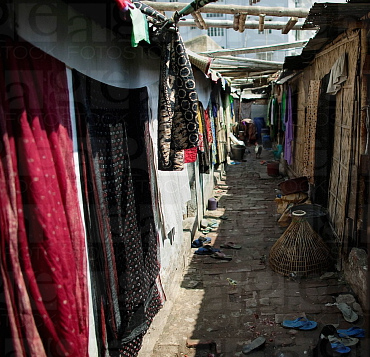 Prostitution cubicles with curtains in a
                      brothel in a town in Asia