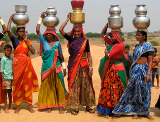 Dalit
                        women in India with water. 6 villages have not
                        one single well...