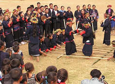 Thailand,
                            Khmu festivity with music and dance in
                            traditional clothes in the village of Ban
                            Chom Ong