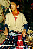 Thailand, Lawa
                                girl weaving in the region of Chian Mai