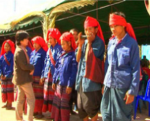 Thailand, Lawa men with flute and
                                women aside