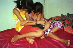 2 girls in a brothel in
              Cambodia