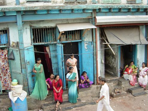 Streets in Kamatipura in Mumbai
              with prostitutes in front of their sex cells