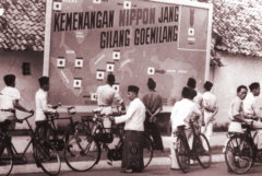 Propaganda billboard
                        celebrating the victories of Japanese troops,
                        including Pearl Harbor in the upper right inset,
                        Jakarta, 1942 - Japan in Indonesia during Second
                        World War WWII