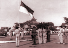 Raising the
                                Indonesian flag at Semarang, 1949.