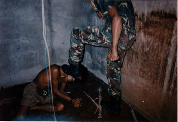 East Timor:
                    torture by Indonesian troops with electroshocks 02,
                    boot