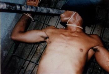 East Timor:
                    torture by Indonesian troops with electroshocks 04
                    with a bamboo stick