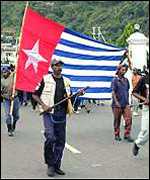 Papua flag
                    with morning star shown at independence
                    demonstration in 2000