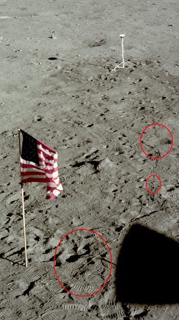 Apolo 11, foto de la NASA no. AS11-37-5480:
                        primer plano del cable de la cmara con sombra
                        dentada, con sombras grises y con la
                        interrupcin del cable