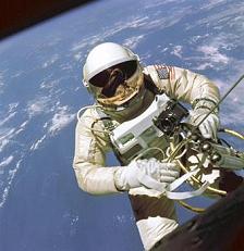 Edward White
                      [officially] on his atmosphere-walk ("space
                      walk"), with a pipe for oxygen supply and
                      radio communication, with rebound pistol for the
                      change of direction.