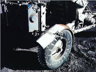 Apollo 17, this wheel of the "moon
                            car" has white spots in the shadow. The
                            manipulators forgot to paint it black