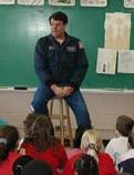 stronaut in a class room, e.g.
                            astronaut Kregel.