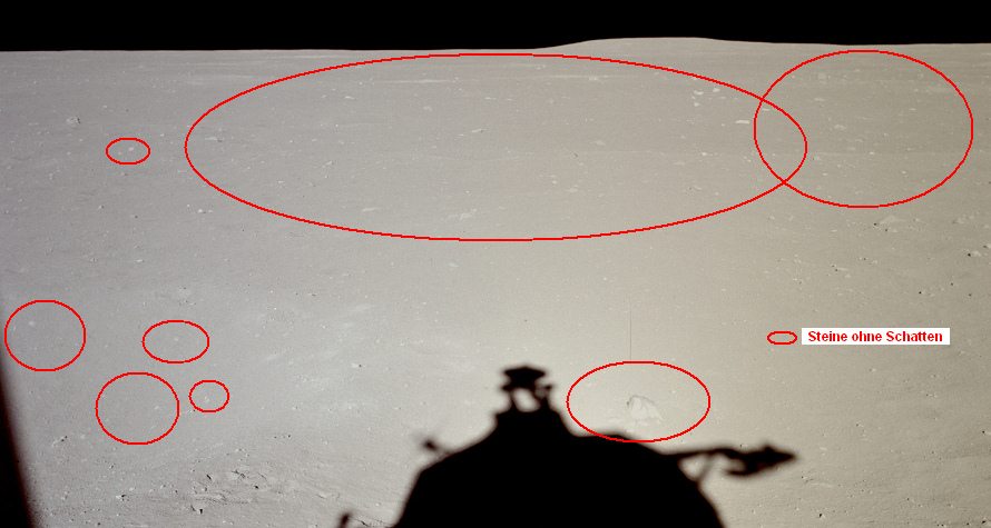 Apollo 11 Foto-Nr. AS11-37-5474:
                        Nahaufnahme der vielen Steinen ohne Schatten
                        oder der unfertigen, weissen Flächen als Steine
