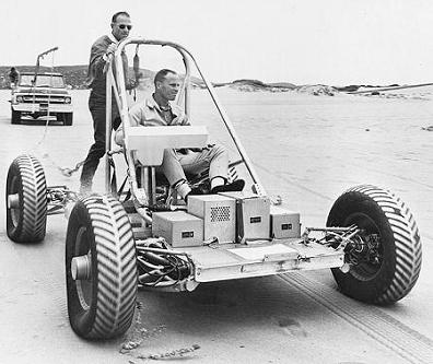 Gerald Carr (left) and Joe Engle (seating)
                        testing a 1:1 model of a "moon car",
                        22. December.1969