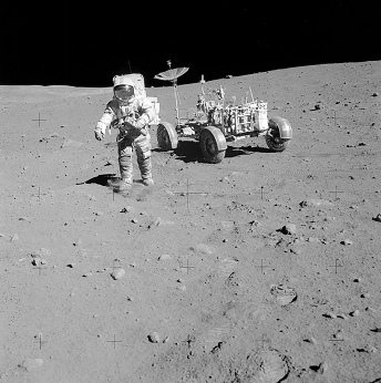 Faked moon landing Apollo 15 photo no.
                        AS15-82-11168: Irwin with the "moon
                        car" LRV ("Rover"). The right
                        back wheel on the picture is impossible, first
                        photo.