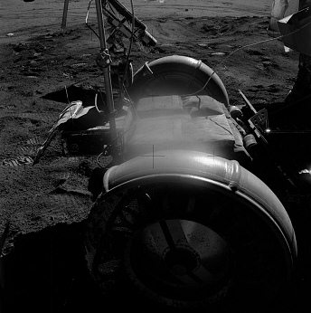 Faked moon landing Apollo 15 photo no.
                        AS15-82-11196: Front of the LRV, background much
                        too dark.