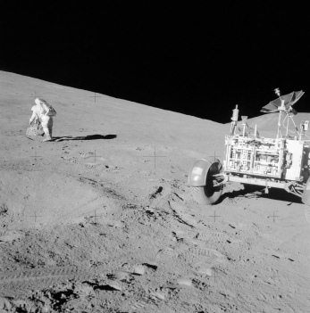 Moon landing Apollo 15, photo no.:
                        AS15-85-11437: Scott at the slope of
                        "Hadley Delta" at the left side,
                        "moon car" at the right side