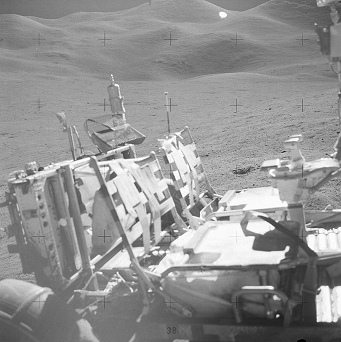 Faked moon landing Apollo 15 photo no.
                        AS15-85-11491: Seats of the "moon
                        car", desert and hill in the background.