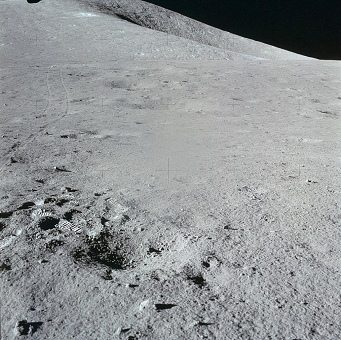 Faked moon landing Apollo 15 photo no.
                        AS15-86-11584: Wheel tracks coming from station
                        2.