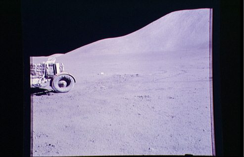 Faked moon landing Apollo 15 photo no.
                        AS15-88-11903. NASA presents the photo with the
                        "moon car" in a distorted way, the
                        wheel is not round.