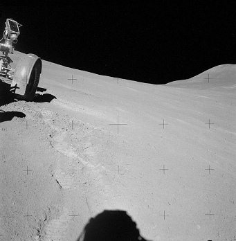 Faked moon landing Apollo 15 photo no.
                        AS15-90-12179: Station 6, the "moon
                        car" is staying at the slope, front wheel
                        visible, and the shadow of the photographing
                        astronaut visible.