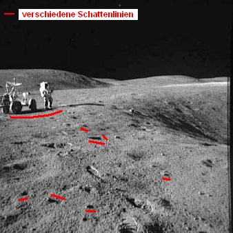 Apollo 16 Foto-Nr. AS16-109-17789: Station
                        1, Astronaut Young mit dem "Mondauto"
                        in der Steinwste