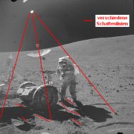 Apollo 16 Foto-Nr. AS16-106-17730:
                "Mondauto" in Steinwüste, Schattenchaos und
                zwei Sonnen.