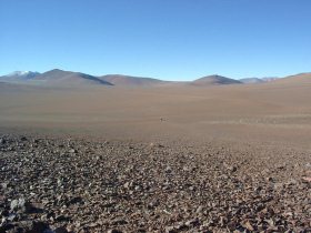 Atacama desert 26: stony plain and line of
                        mountains