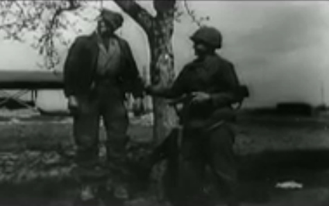 A man hanging on a rope on a tree,
                            presented by an "American" soldier
                            (24min. 21sec.)