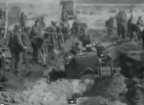 Region of Bergen-Belsen: SS has to
                              dig out a mass grave and allies are
                              helping with a bulldozer (6min. 48sec.)