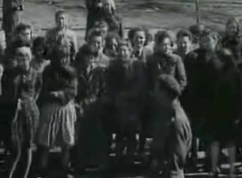 Public with emotions watching the lorry
                            full of emaciated dead bodies coming
                            probably from the Rhine meadow camps (12min.
                            48sec.)