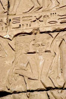 Philistines with feathers on their heads.
                    Illustration in the temple in Medinet Habu, built
                    under Ramesses III