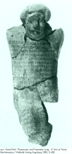 Broken figurine with a text with
                              condemnations