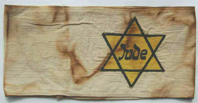 Germany, armband in white with yellow
                          Jewish star with black inscription
                          "Jude" ("Jew")