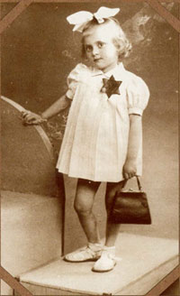 France, girl in white with dark Jewish star
                        with inscription "Juif"
                        ("Jew")