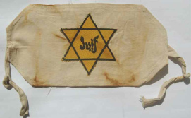 France, white armband for children with
                          yellow Jewish star with inscription
                          "Juif" ("Jew")