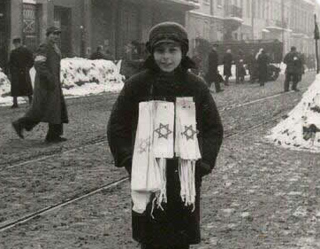 Woman
                        armband distributor with armbands with Jewish
                        star on white background