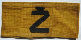 Yugoland, yellow armband with the
                          inscription "" in black